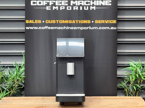 Dr. Coffee MF3 Commercial Milk Texturing Machine in Black with touchscreen display and milk dispensing spout - front view