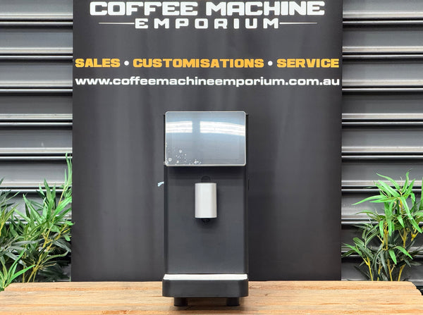 Dr. Coffee MF3 Commercial Milk Texturing Machine in Black with touchscreen display and milk dispensing spout - front view